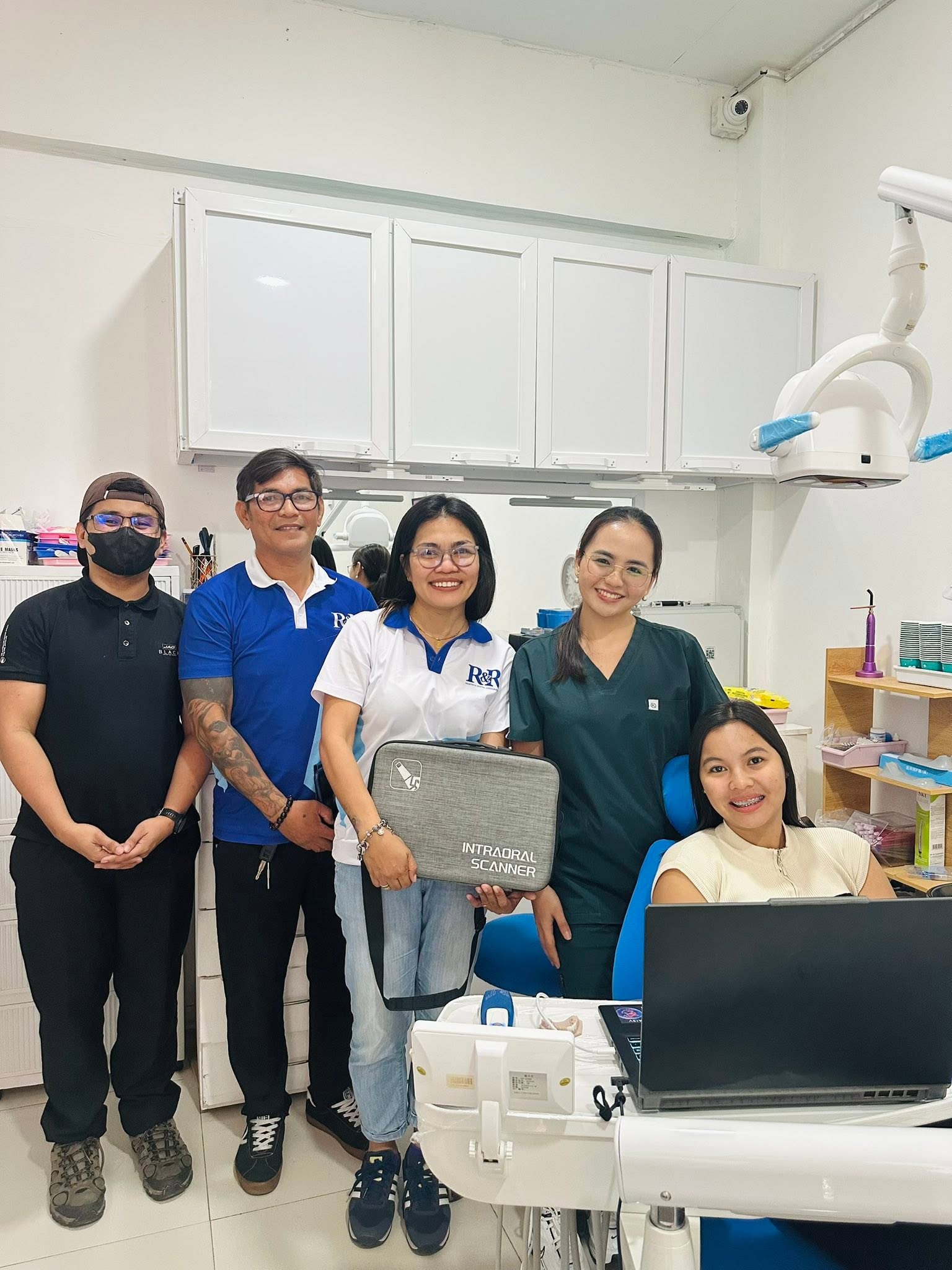 The Gacutan Dental Clinic team with a new digital intraoral scanner